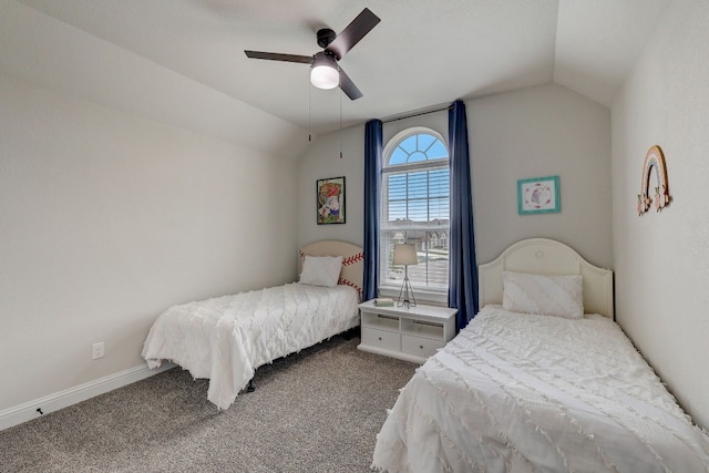 bedroom featuring carpet flooring, vaulted ceiling, and ceiling fan