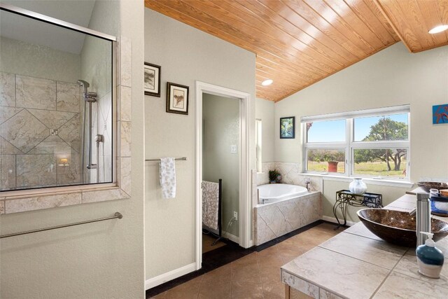 tiled bedroom featuring wood ceiling, sink, and vaulted ceiling