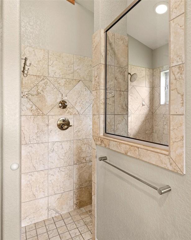 bathroom with a tile shower