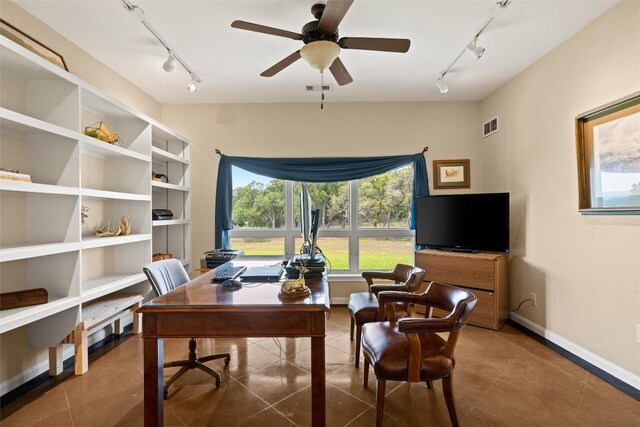 tiled office space featuring ceiling fan