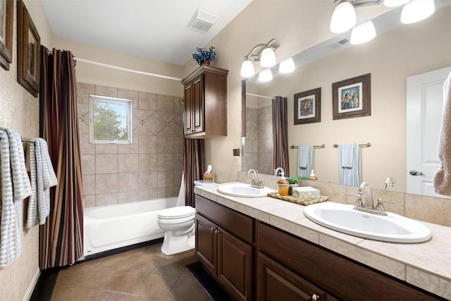 full bathroom featuring tile patterned flooring, vanity, shower / bath combination with curtain, and toilet