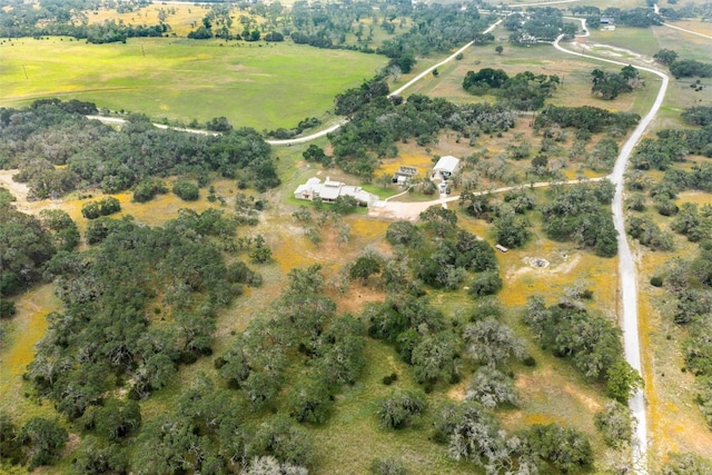 birds eye view of property featuring a rural view
