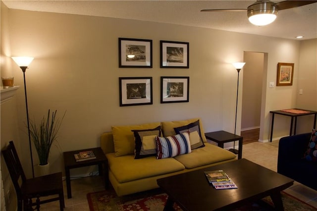 tiled living room featuring ceiling fan