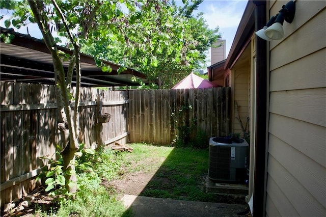 view of yard with central AC