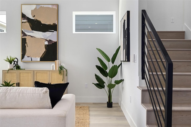 living area with light hardwood / wood-style flooring