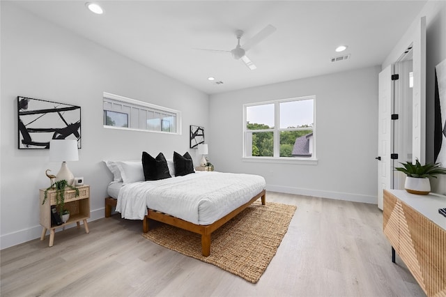 bedroom featuring light wood-type flooring and ceiling fan