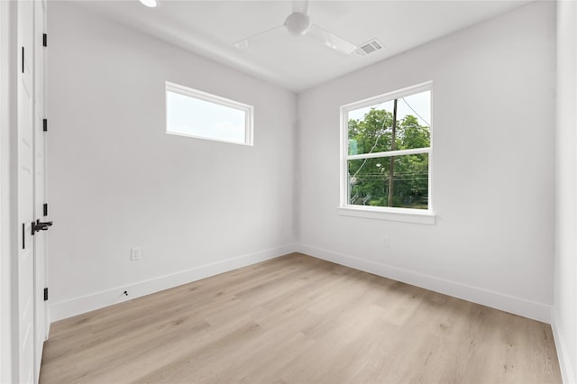 empty room with light hardwood / wood-style floors