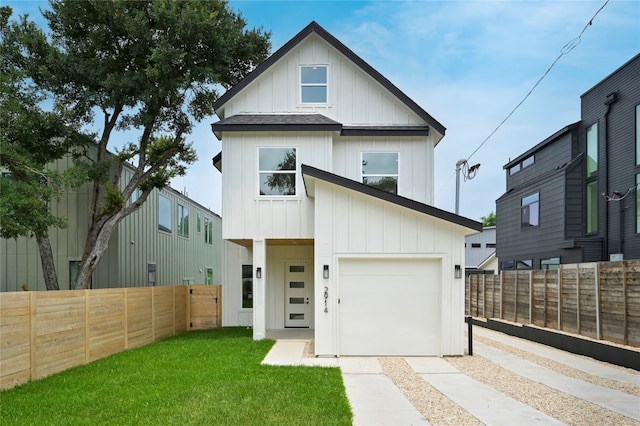 view of front of property with a garage and a front yard