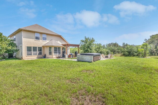 rear view of property with a patio area and a lawn