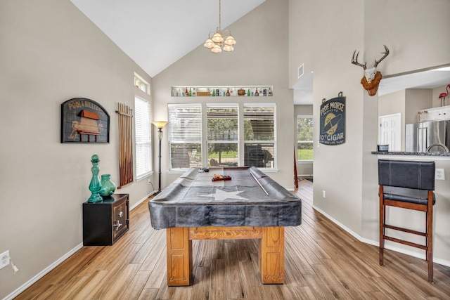 game room featuring pool table, high vaulted ceiling, and light hardwood / wood-style floors