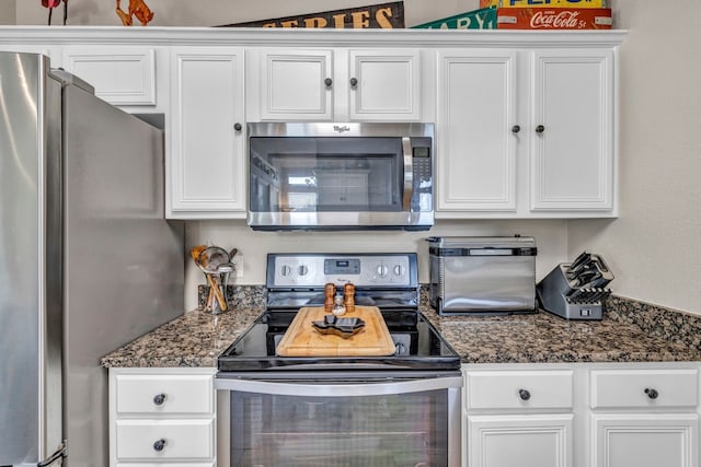 kitchen featuring appliances with stainless steel finishes and white cabinetry