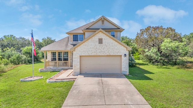 view of front of home featuring a garage and a front yard