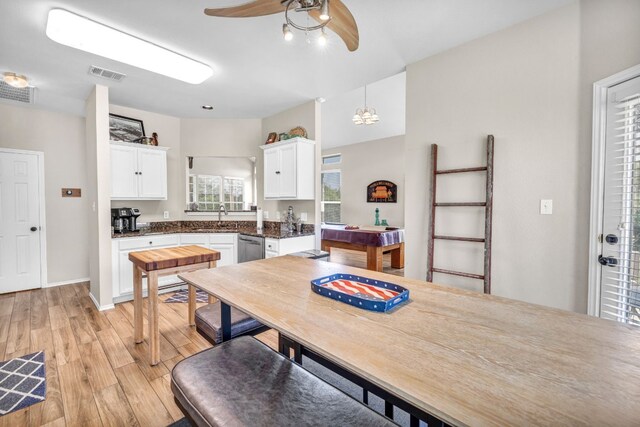 dining room with light hardwood / wood-style floors and ceiling fan