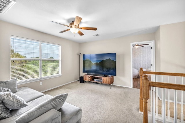 living room with carpet flooring and ceiling fan