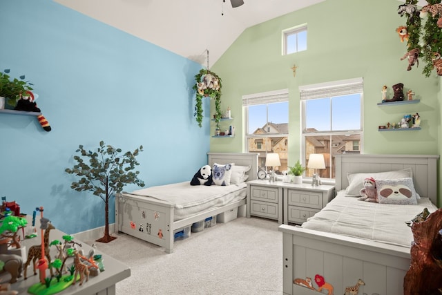 bedroom with light colored carpet, high vaulted ceiling, and ceiling fan