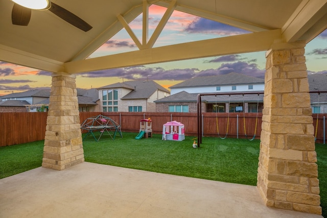 patio terrace at dusk with a lawn