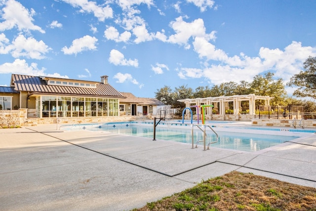 view of swimming pool with a pergola and a patio