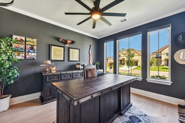 office area featuring light hardwood / wood-style floors, ornamental molding, and ceiling fan