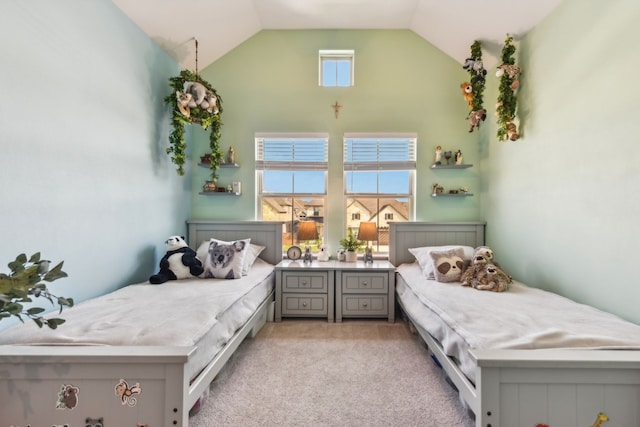 bedroom featuring vaulted ceiling and light colored carpet