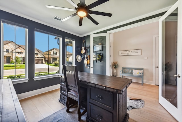 home office featuring crown molding, light hardwood / wood-style flooring, and ceiling fan