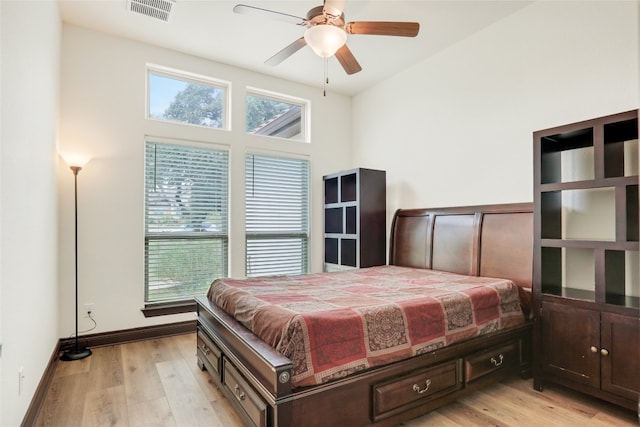 bedroom with ceiling fan and light hardwood / wood-style flooring