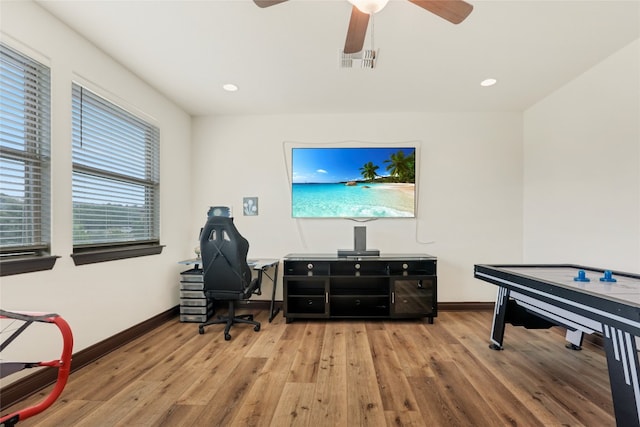 office area featuring light hardwood / wood-style floors and ceiling fan