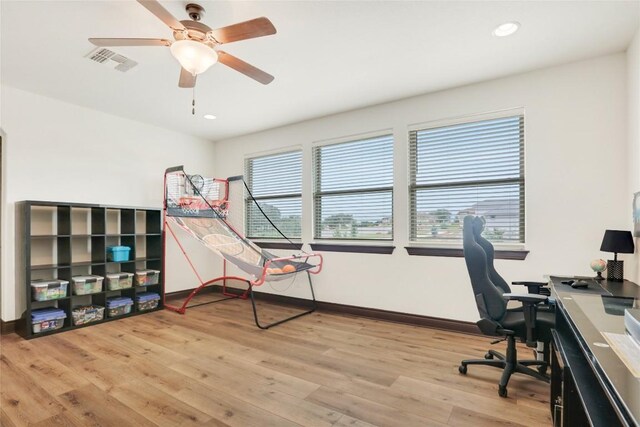 office area featuring light hardwood / wood-style floors and ceiling fan