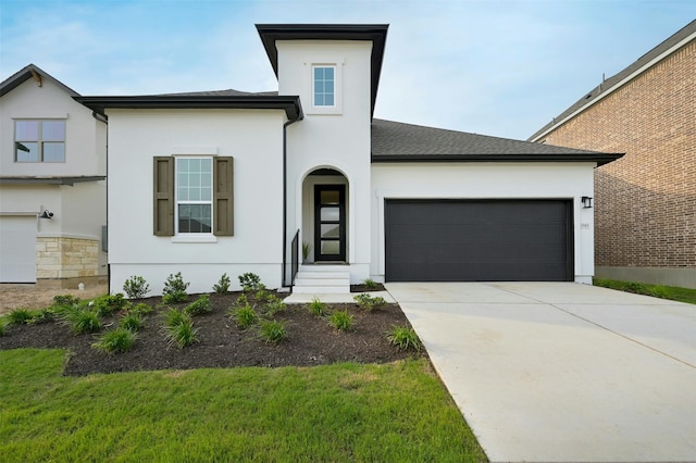 view of front of house with a garage and a front yard