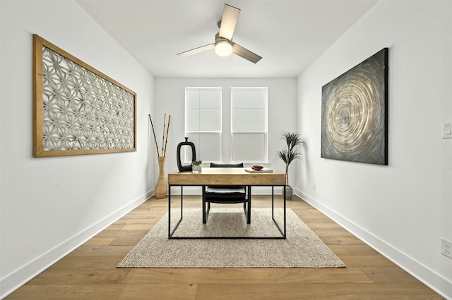 home office featuring ceiling fan and wood-type flooring