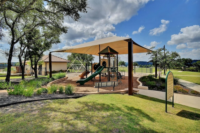 view of playground with a yard