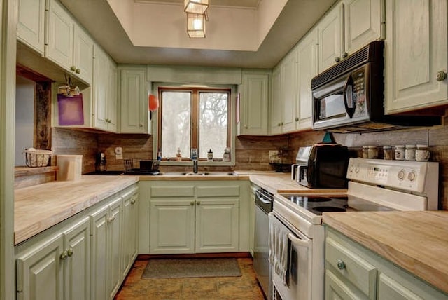 kitchen featuring backsplash, butcher block countertops, sink, and electric stove