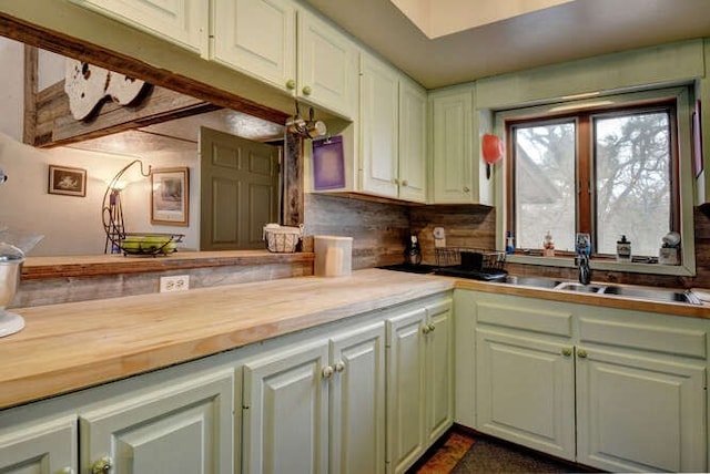 kitchen featuring wooden counters and tasteful backsplash