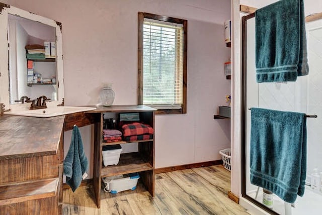 bathroom with vanity and hardwood / wood-style flooring