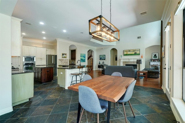 dining area featuring a fireplace and sink