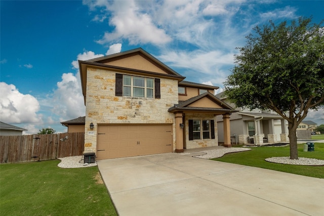 view of front of home with a garage and a front lawn