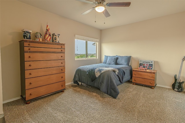 bedroom featuring light colored carpet and ceiling fan