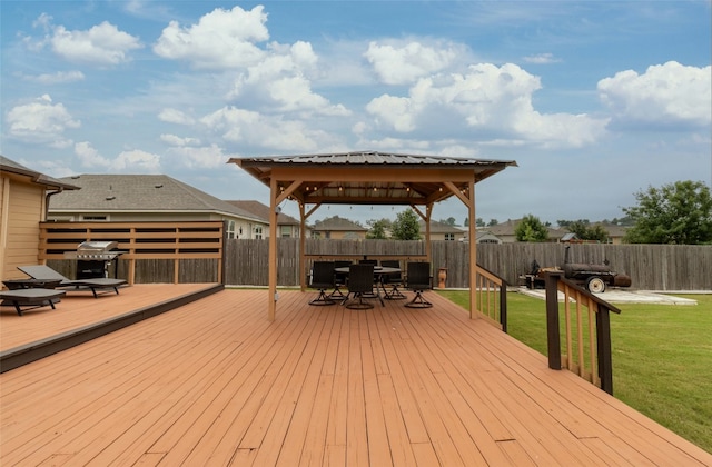 deck with a grill, a yard, and a gazebo