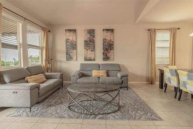 tiled living room with plenty of natural light