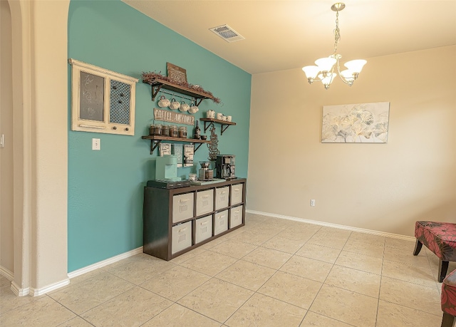 interior space with a notable chandelier and light tile floors