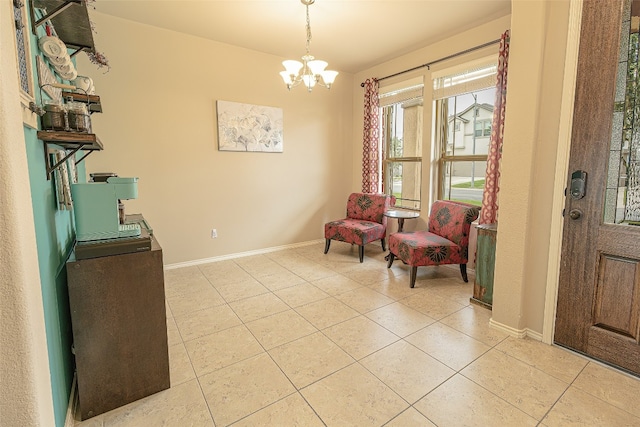 living area with tile flooring and an inviting chandelier