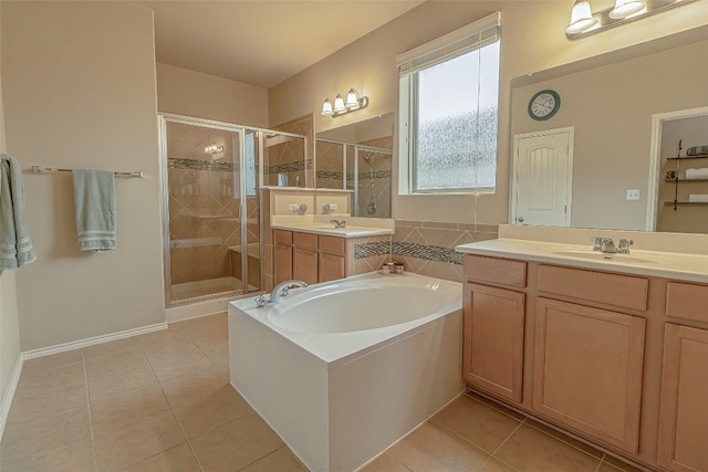 bathroom with tile floors, dual vanity, and plus walk in shower