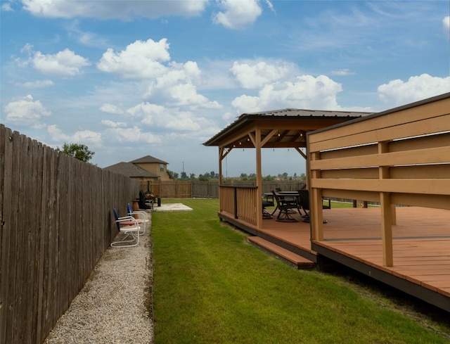 view of yard with a deck and a gazebo