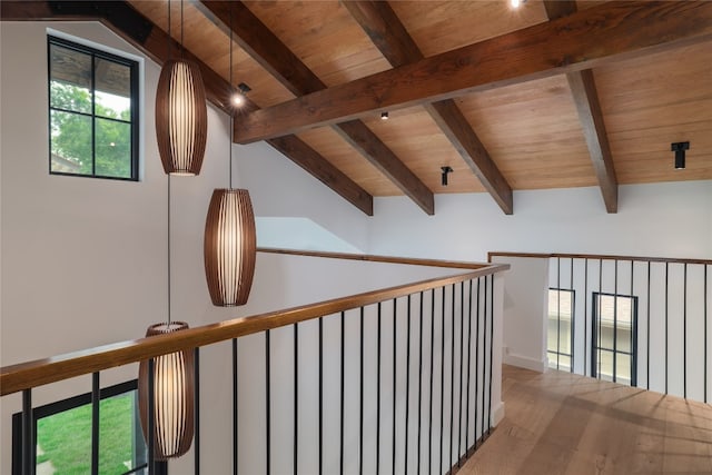 corridor with wood-type flooring, vaulted ceiling with beams, and wood ceiling