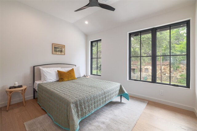 bedroom featuring wood-type flooring and multiple windows