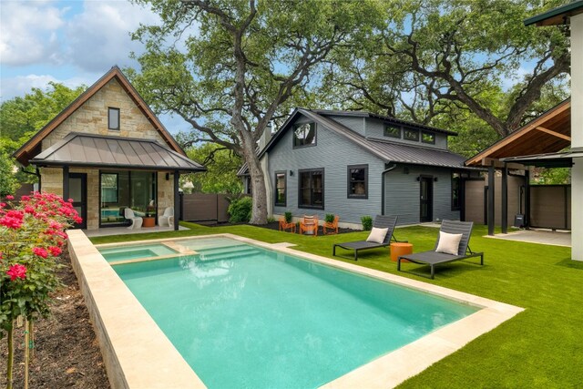 view of swimming pool featuring a yard and a patio