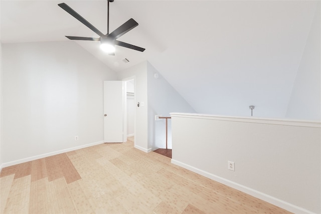 bonus room with vaulted ceiling, ceiling fan, and light hardwood / wood-style flooring