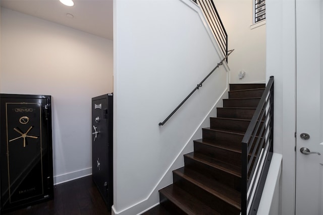 staircase featuring hardwood / wood-style floors