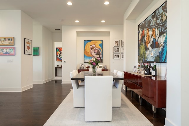 dining room featuring dark hardwood / wood-style flooring