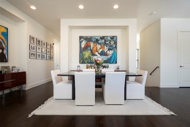 dining area with dark hardwood / wood-style floors