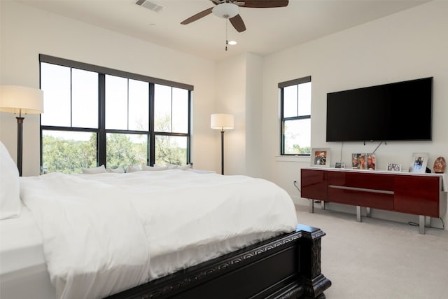 bedroom with ceiling fan and carpet floors